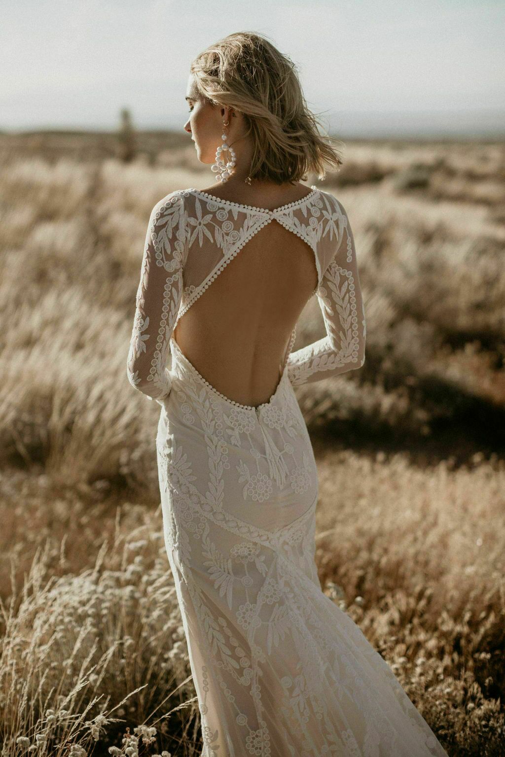 lace open back wedding dress High Neck Boho Long Sleeves With TN307  Tirdress Inca is a piece of art with unique shapes and contouring Open Back Lace Wedding Dress